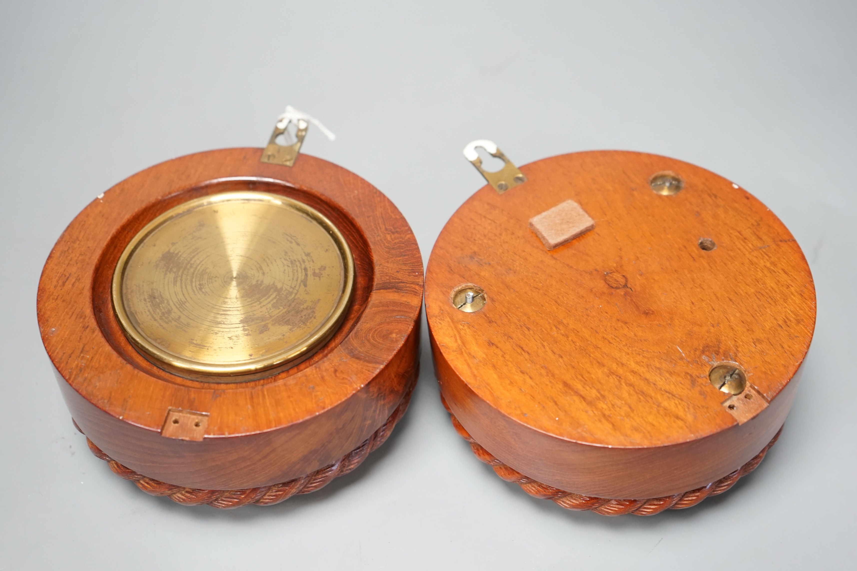 A Victorian teak cased bulkhead timepiece by Benzie, Cowes, Isle of Wight with matching aneroid barometer, both with carved rope twist cases, 15cm. diam.